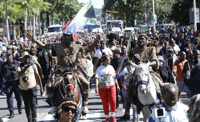 Men adorned in traditional Zulu attire, affiliated to the March and March movement, continue to march through the streets of Durban, calling for the removal of illegal foreign nationals in the country.